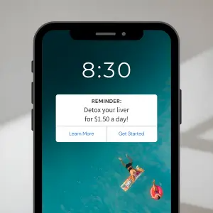 Smartphone lock screen showing 8:30 over an aerial pool wallpaper with a white reminder banner reading 'Detox your liver for $1.50 a day!'