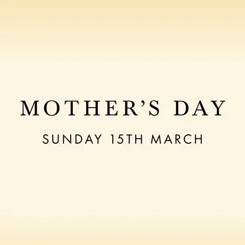 minimalist text-only ad for a Mother's Day gifting promotion in an elegant serif on a cream-to-gold gradient